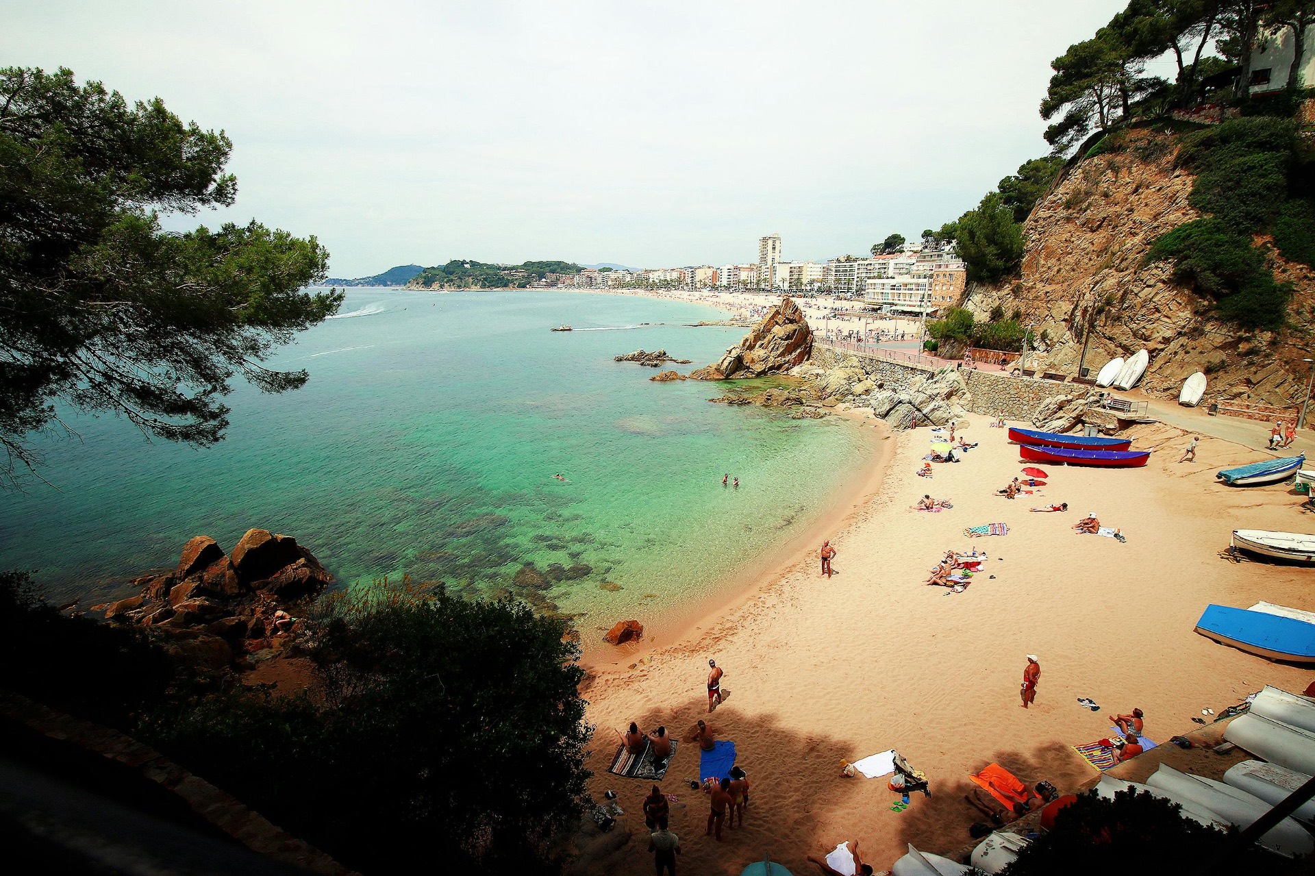 Aerial view of Lloret de Mar beach and old town at golden hour, Costa Brava